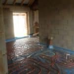 Covering Underfloor Heating Pipes with Liquid Screed