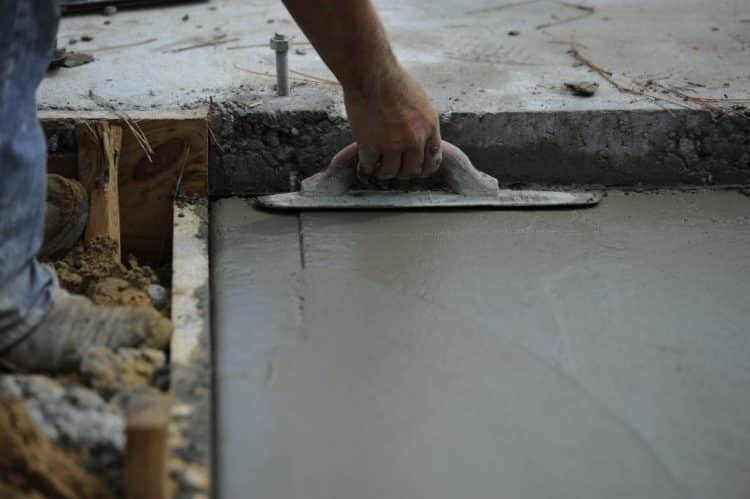 Screed Contractors Levelling Concrete Floor Screed for Smooth Finish - hand smoothing tool close up