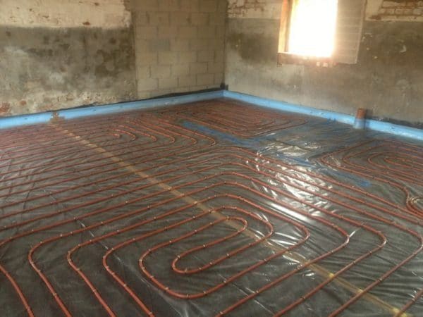 Underfloor Heating installation - red pipework laid and complete