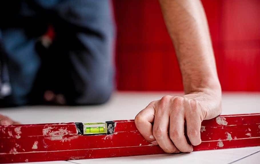 level floor close up of leveller, spirit level- sand and cement screed