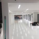 Showroom Screeding Process - shiny white liquid floor, white walls
