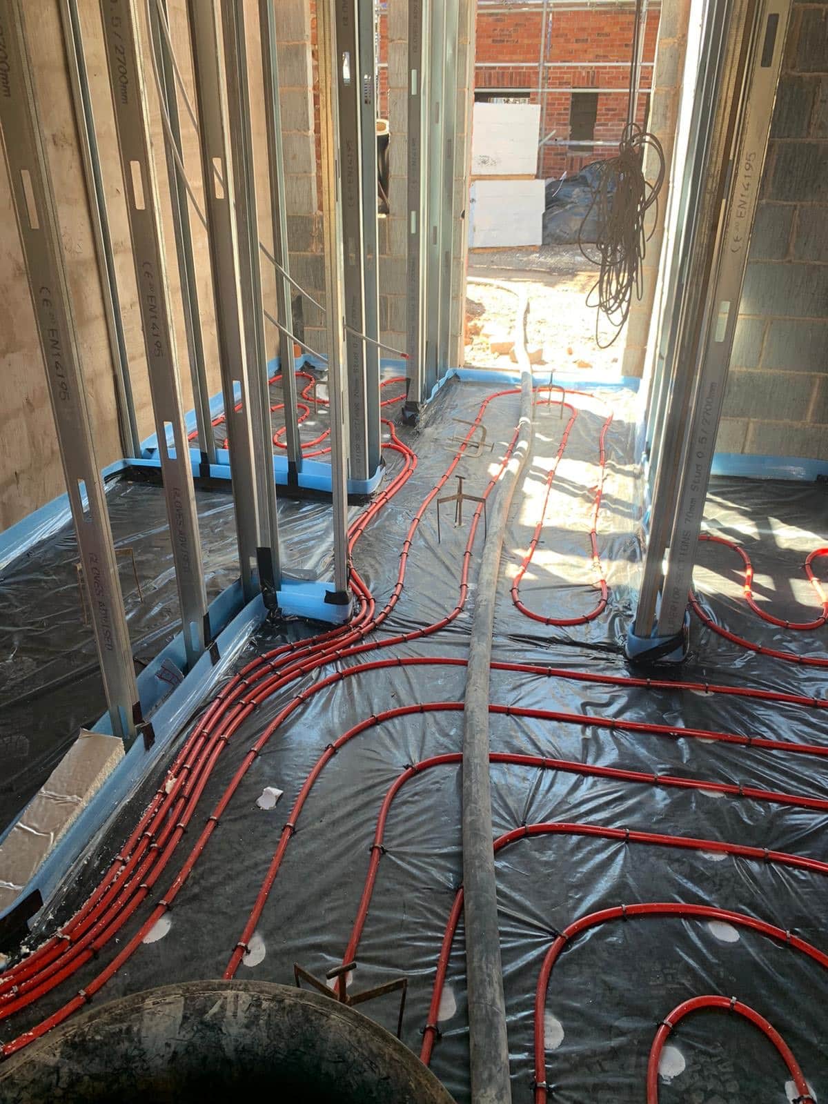 Underfloor Heating Installation complete, doorway to a new build home previous to concrete liquid