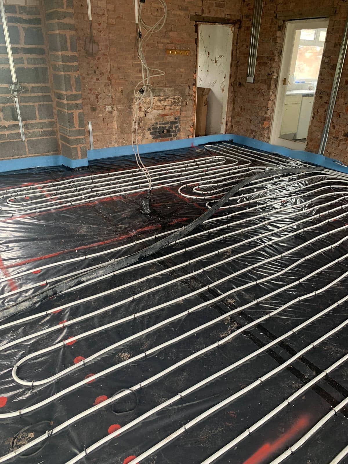 Underfloor Heating white pipework installed and complete before concrete liquid added