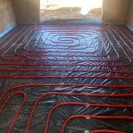 Red Pipework for Underfloor Heating complete before liquid is poured