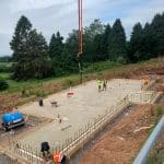 Outdoor Screeding Installation - before liquid screed is applied - three men in preparation