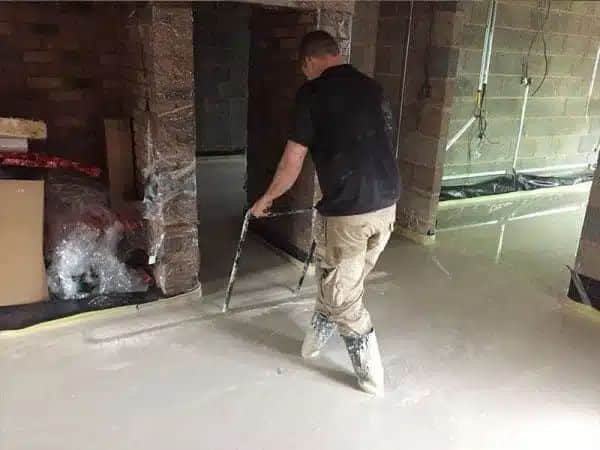GM_Floor_Screeds_Liquid_Floor_Screed_West_Midlands_2 GM Floor Screeds Liquid floor screed in the west midlands man screeding indoors