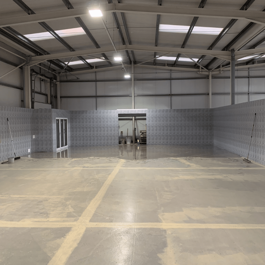 An industrial warehouse before screeding by liquid screed installers Birmingham GM Floor Screeds