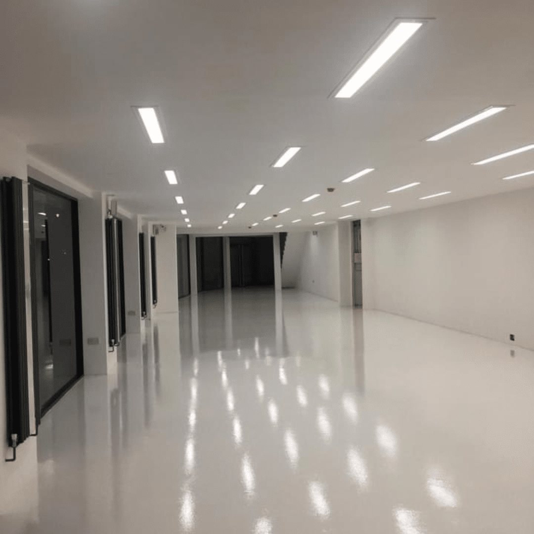 Liquid screed applied to a commercial building by floor screeding suppliers near me GM Floor Screeds