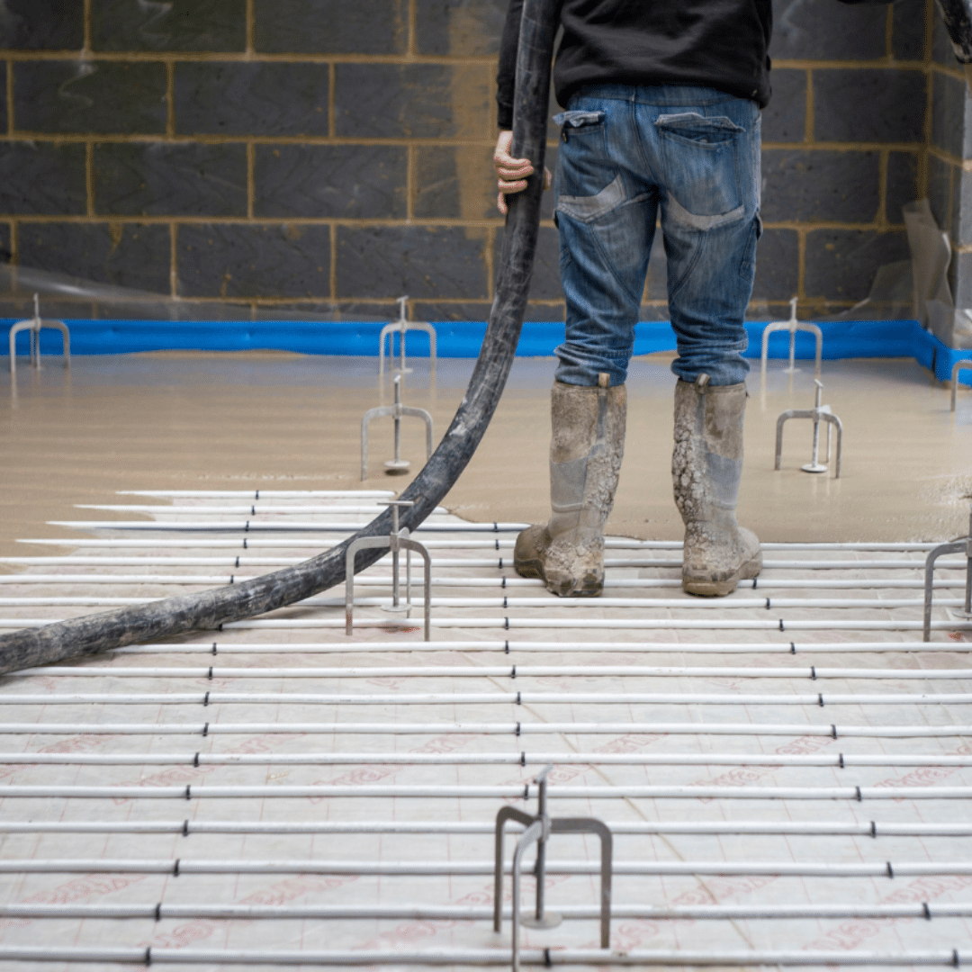 An underfloor heating system being installed with liquid screed by a GM Floor Screeds installer