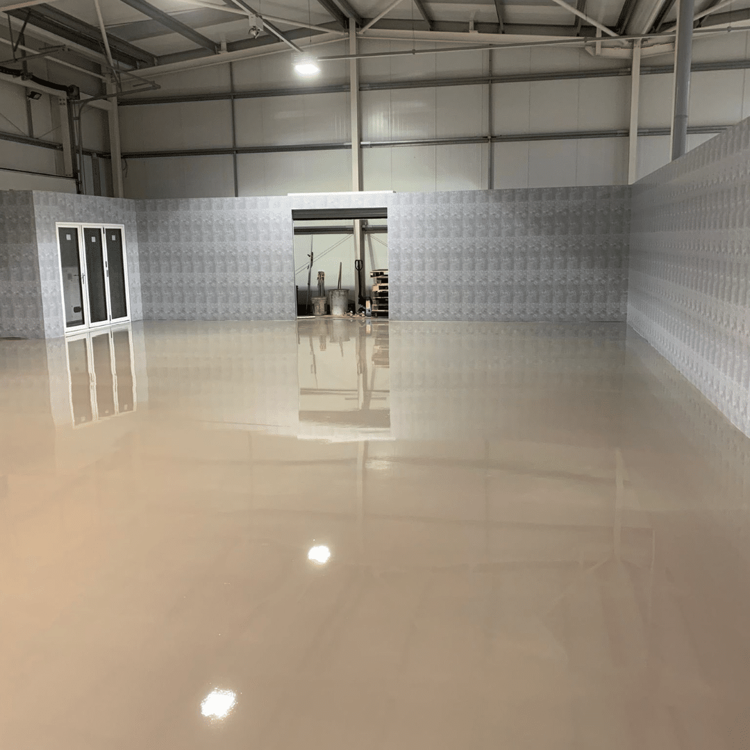 A floor of a warehouse after screeding by liquid floor screed installers Rugby: GM Floor Screeds